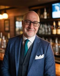 Portrait of businessman standing in store