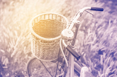 Close-up of bicycle parked on field