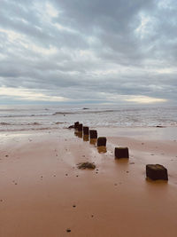 Scenic view of beach against sky