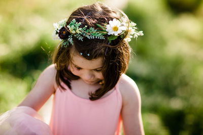 Portrait of girl with pink flower