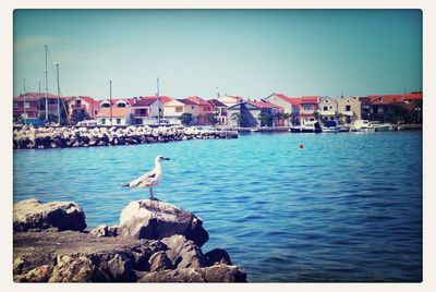 View of sea with buildings in background