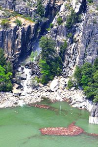 Scenic view of waterfall on cliff