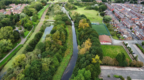 High angle view of street amidst trees in city