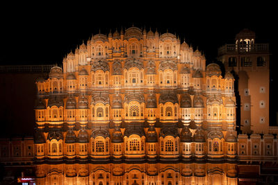 Low angle view of illuminated building at night