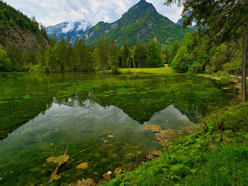 Scenic view of lake and mountains against sky