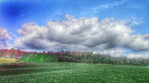 Scenic view of landscape against cloudy sky