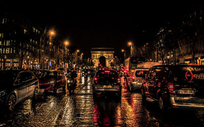 Illuminated city street at night