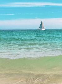 Sailboat sailing on sea against sky