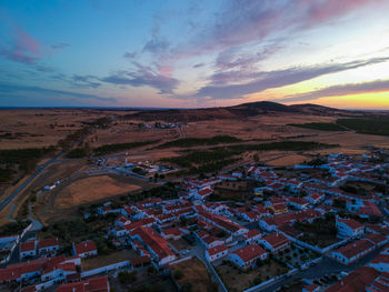 High angle view of townscape against sky at sunset