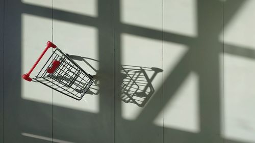 Empty trolley on a white background with window shadow