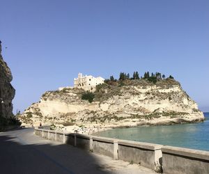 Panoramic shot of sea against clear blue sky