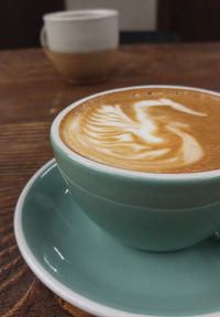 Close-up of cappuccino on table