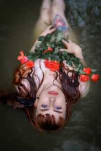 High angle portrait of woman swimming in water