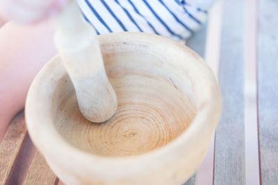 Close-up of wooden pestle and morter