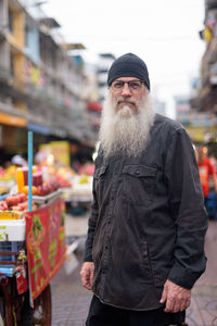 Man standing on street market in city