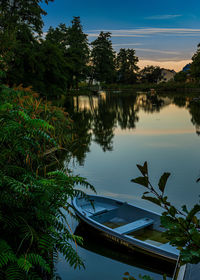 Boats moored in lake