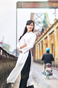 Young vietnamese girl wearing ao dai dress.