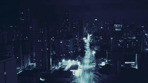 High angle view of illuminated cityscape at night
