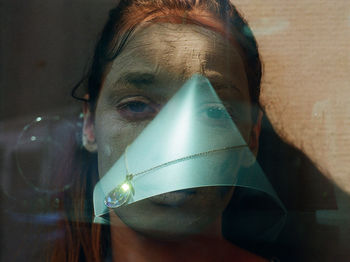 Double exposure of woman and diamond necklace