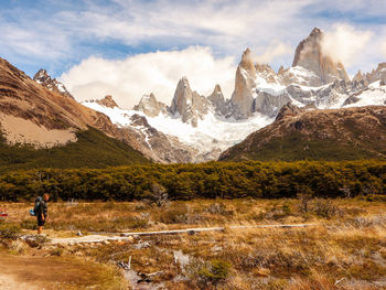 Scenic view of mountains against cloudy sky