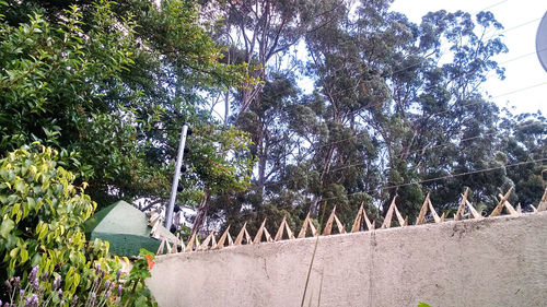 Low angle view of bridge against sky on sunny day