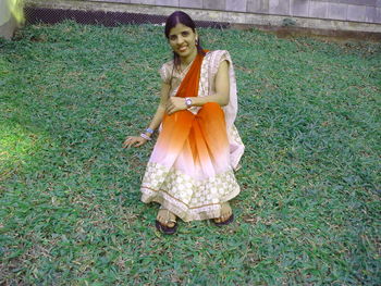 Full length of girl standing on field