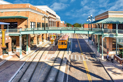 Panoramic view of city street and buildings against sky