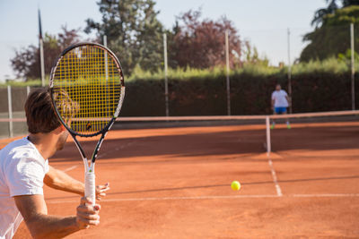 Man playing with ball in background