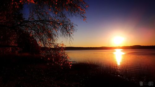 Scenic view of sea against sky at sunset