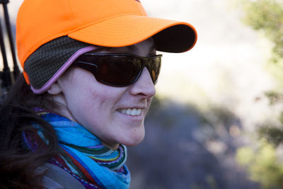 Female hunter looks for elk on a cold morning in fall in colorado