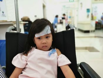 Portrait of a girl sitting on seat