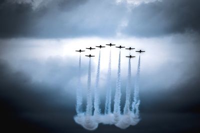 Low angle view of airplane flying in sky