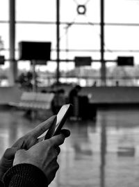 Close-up of hand holding cigarette