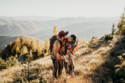 Rear view of man standing on mountain