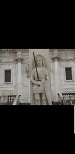 Low angle view of statue of historic building