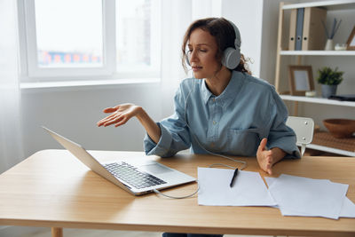 Businesswoman working on table