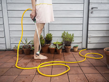 Low section of people standing on tiled floor