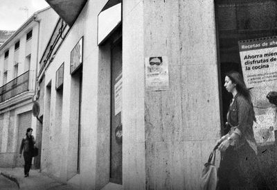 Woman standing in front of building