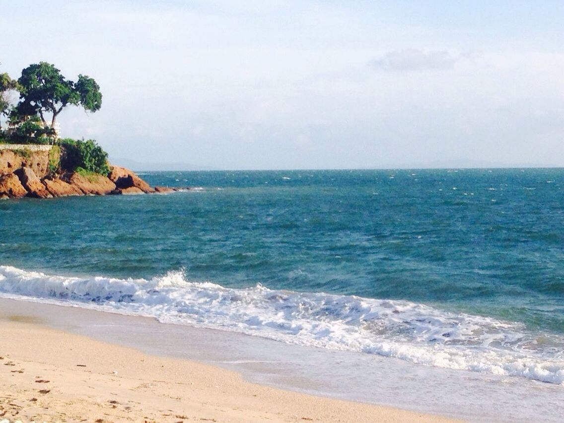 sea, horizon over water, water, beach, scenics, wave, beauty in nature, surf, tranquil scene, shore, sky, tranquility, nature, sand, idyllic, coastline, seascape, cliff, day, remote