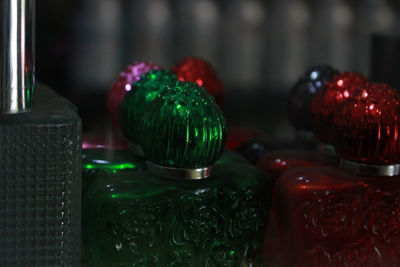 Close-up of multi colored bottles on table