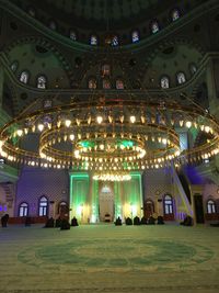 Illuminated ceiling of building at night