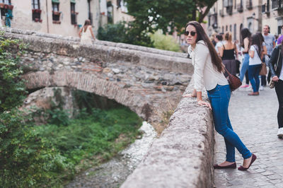 Woman standing in city