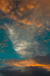 Low angle view of dramatic sky during sunset