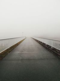 Empty road against sky