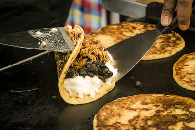 Close-up of hand holding food