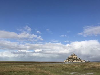 View of temple against cloudy sky