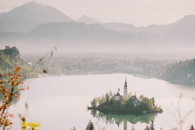 Scenic view of lake with mountain range in background