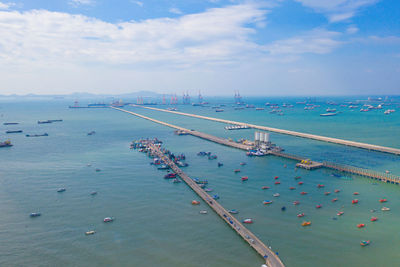 High angle view of boats in sea against sky