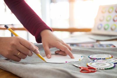 Close-up of boy drawing on paper