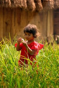 Close-up of girl in grass